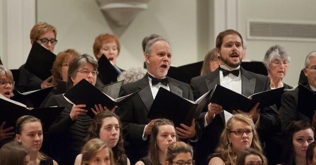 dressed up choir singing at a theater production in ashland ohio join a music group