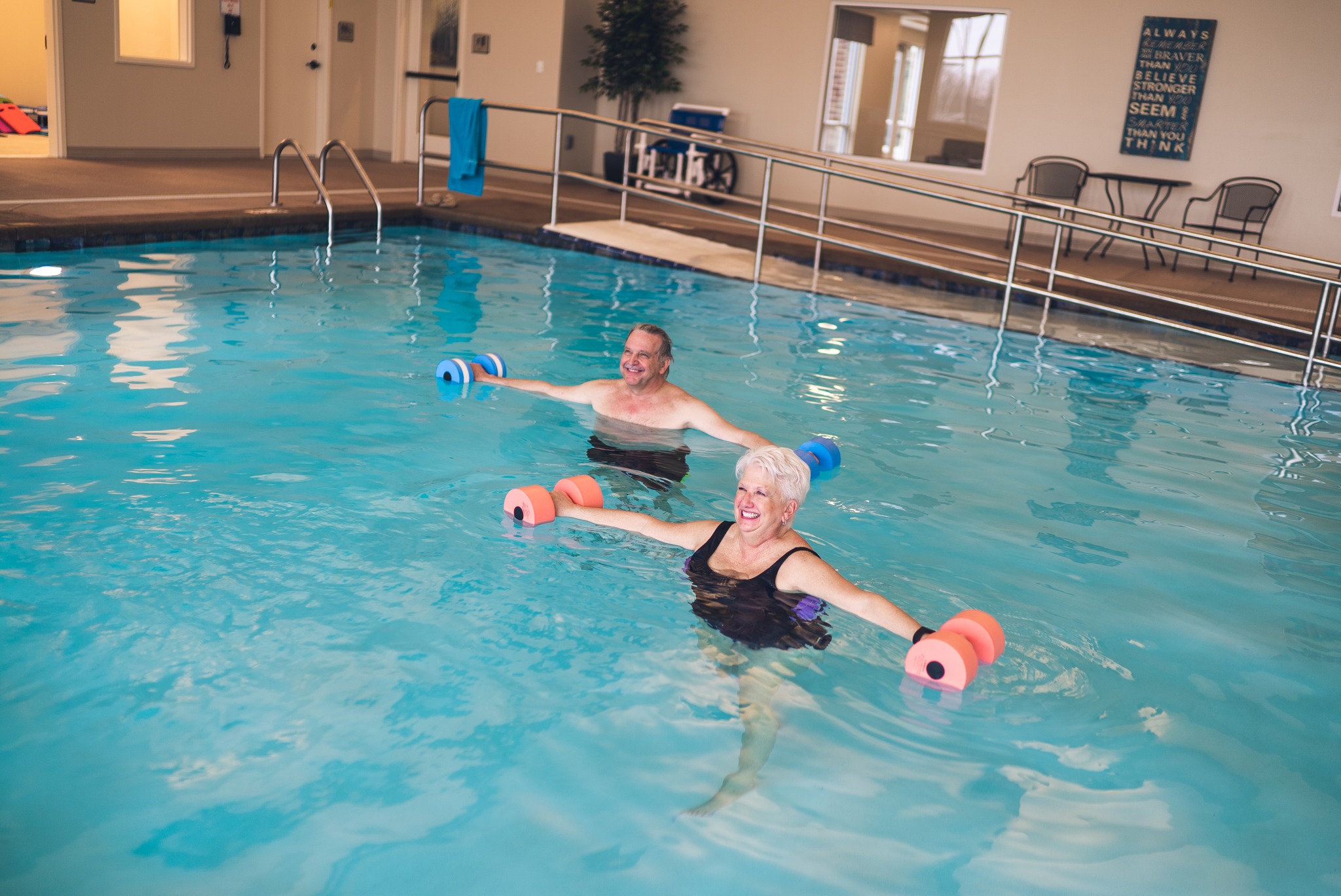 two women doing water aerobics at bretheren care village wellness