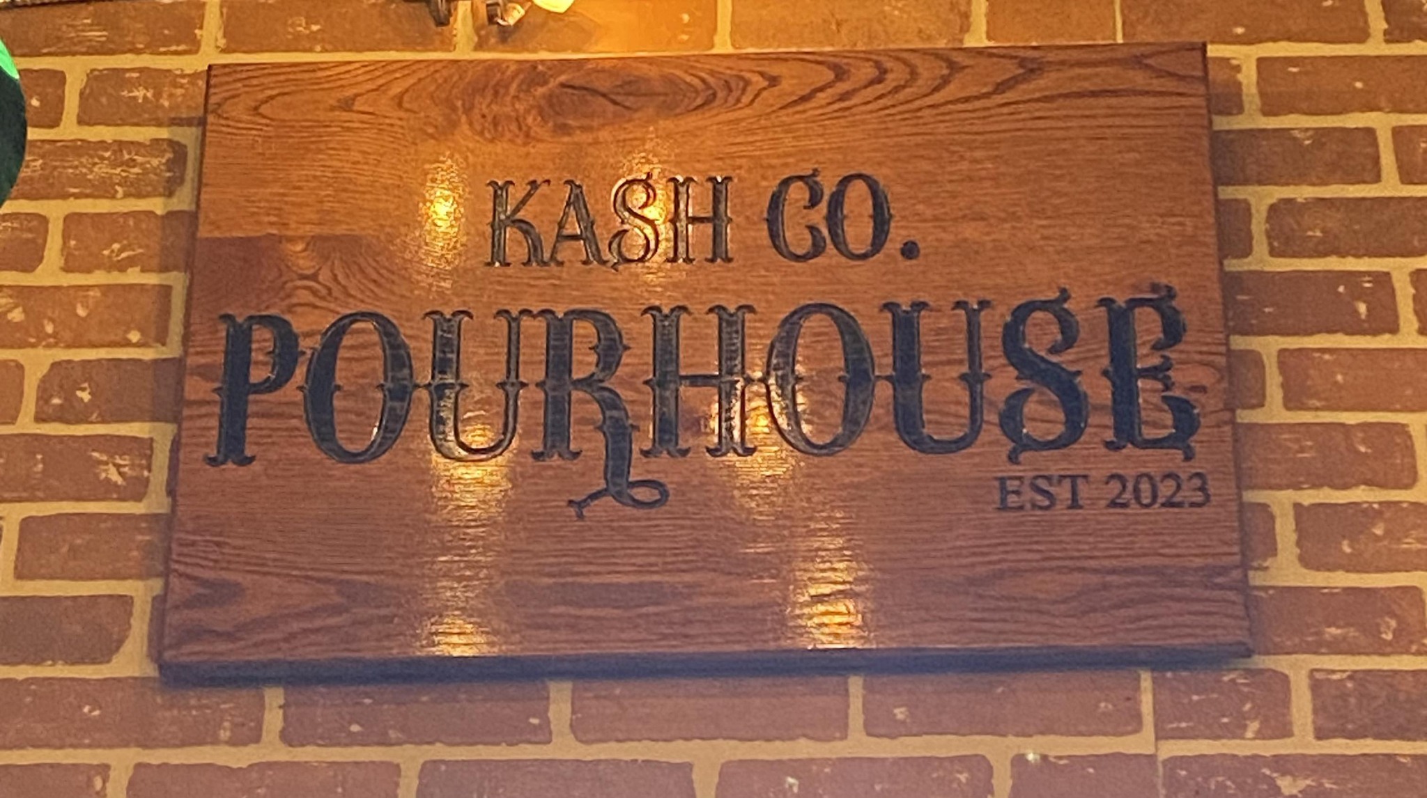 wooden sign at kash co pourhouse in ashland ohio