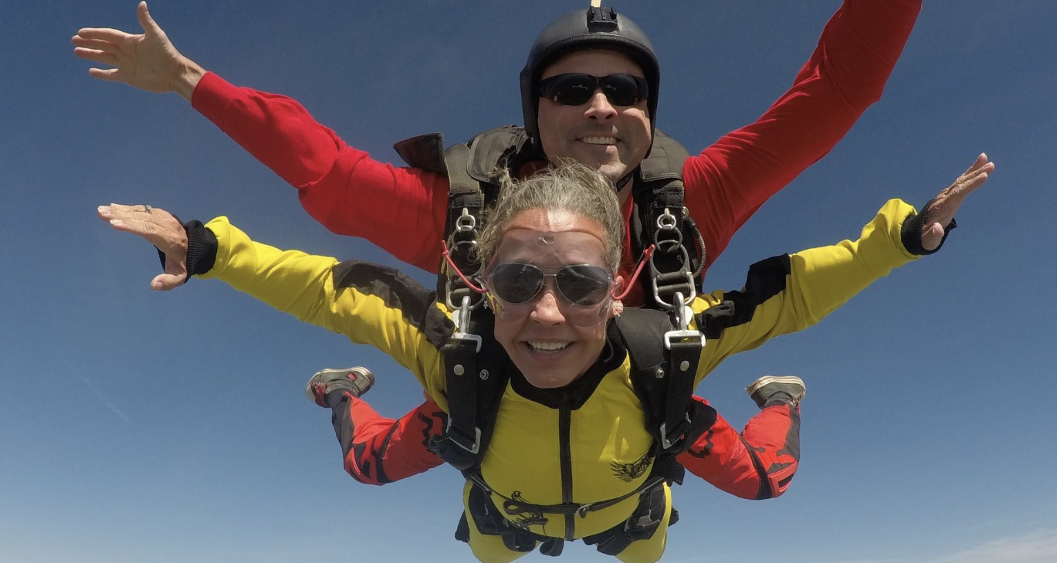 couple tandem skydiving
