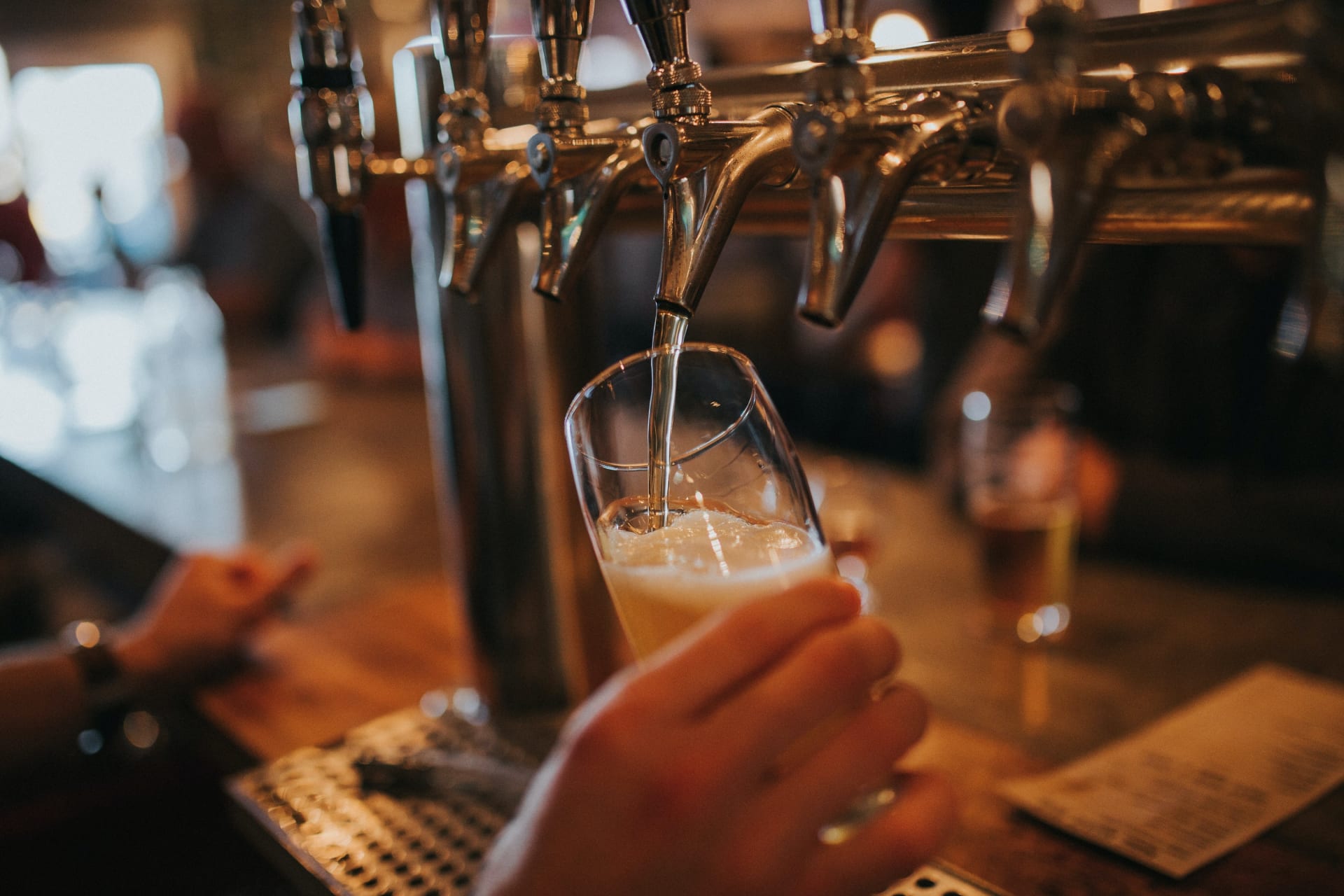bartender pouring a beer from a tap ashland nightlife