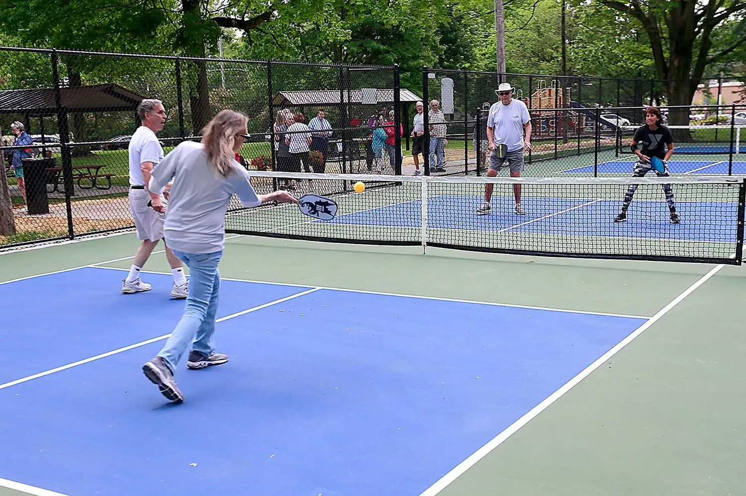 group of people playing pickleball Golf, Pickleball & More