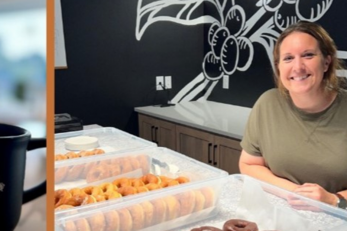 Melissa from Farmstead kitchen smiling next to her handmade donuts ready at goldberry roasting company