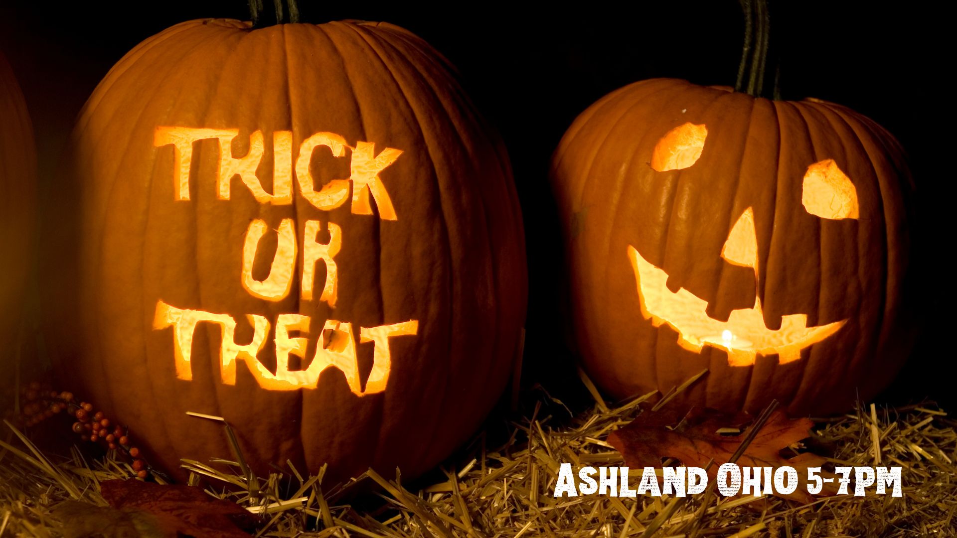 two jack o lanterns, one carved with trick or treat, the other a traditional jack o lantern face