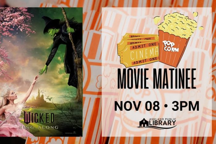 Elphaba in the top right corner reaching for Glinda in the bottom left who is also reaching for Elphaba