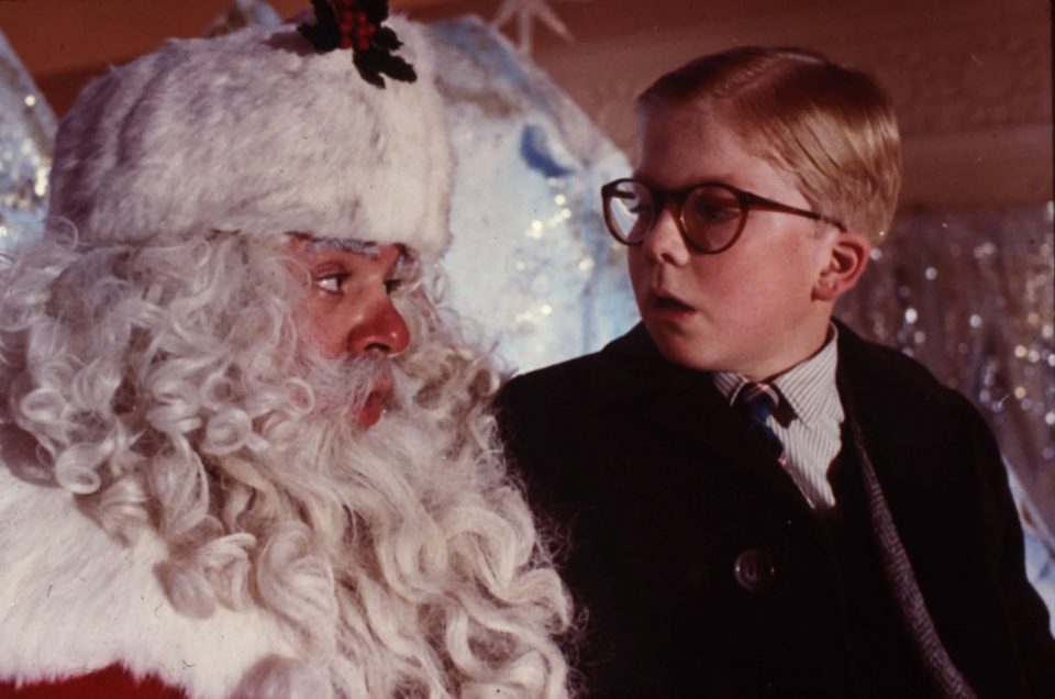 Ralphie from "A Christmas Story" sitting on the mall Santa's lap telling him he wants the Red Rider BB Gun