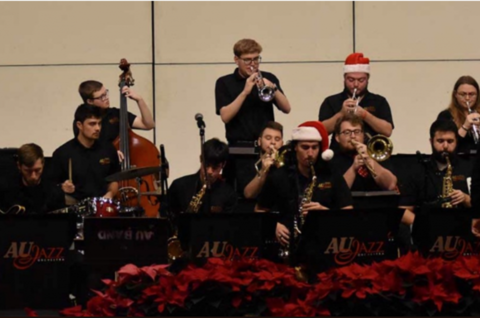 AU Jazz band members playing a concert with some of them wearing Santa hats