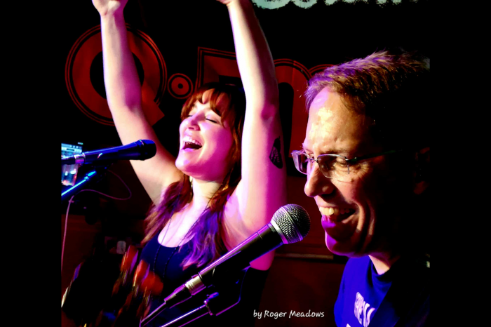Paul Blubaugh and his daughter Sarah Blubaugh singing together and smiling